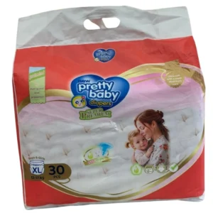 Red and white packaging of New Pretty Baby Super Premium Diapers, Size XL for boys and girls weighing 12 to 17 kg. The 30-piece value pack features a carry handle and an illustration of a mother hugging her child, highlighting 12-hour overnight protection and an ultra-soft absorbent core.
