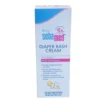 Front view of a white and light blue vertical box of Baby Sebamed Diaper Rash Cream. The packaging features a "clinically tested pH 5.5" logo, text highlighting "With Panthenol" in a pink bar, key product benefits listed in bullet points, and a small illustration of a crawling baby wearing a diaper.